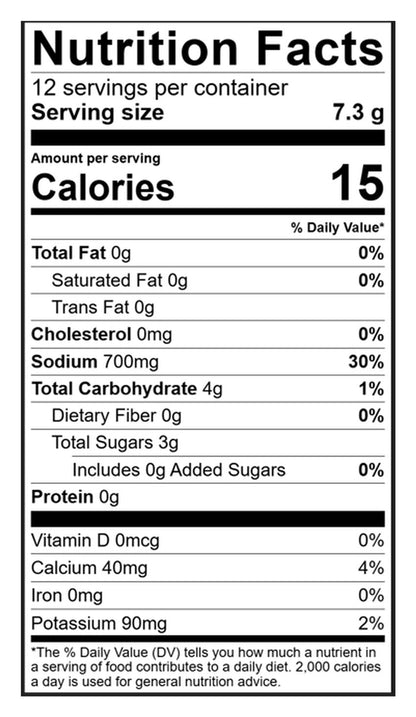A Nutrition Facts label on a black background, showing serving size 7.3 g, 15 calories per serving, and nutrient values for total fat, saturated fat, trans fat, cholesterol, sodium, carbohydrate, sugars, protein, vitamin D, calcium, iron, and potassium.