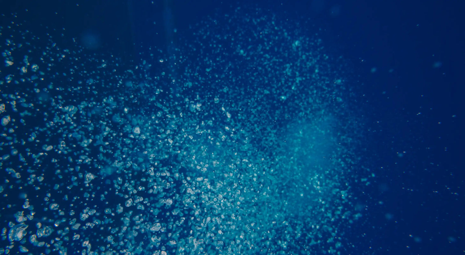 Blue underwater scene with particles