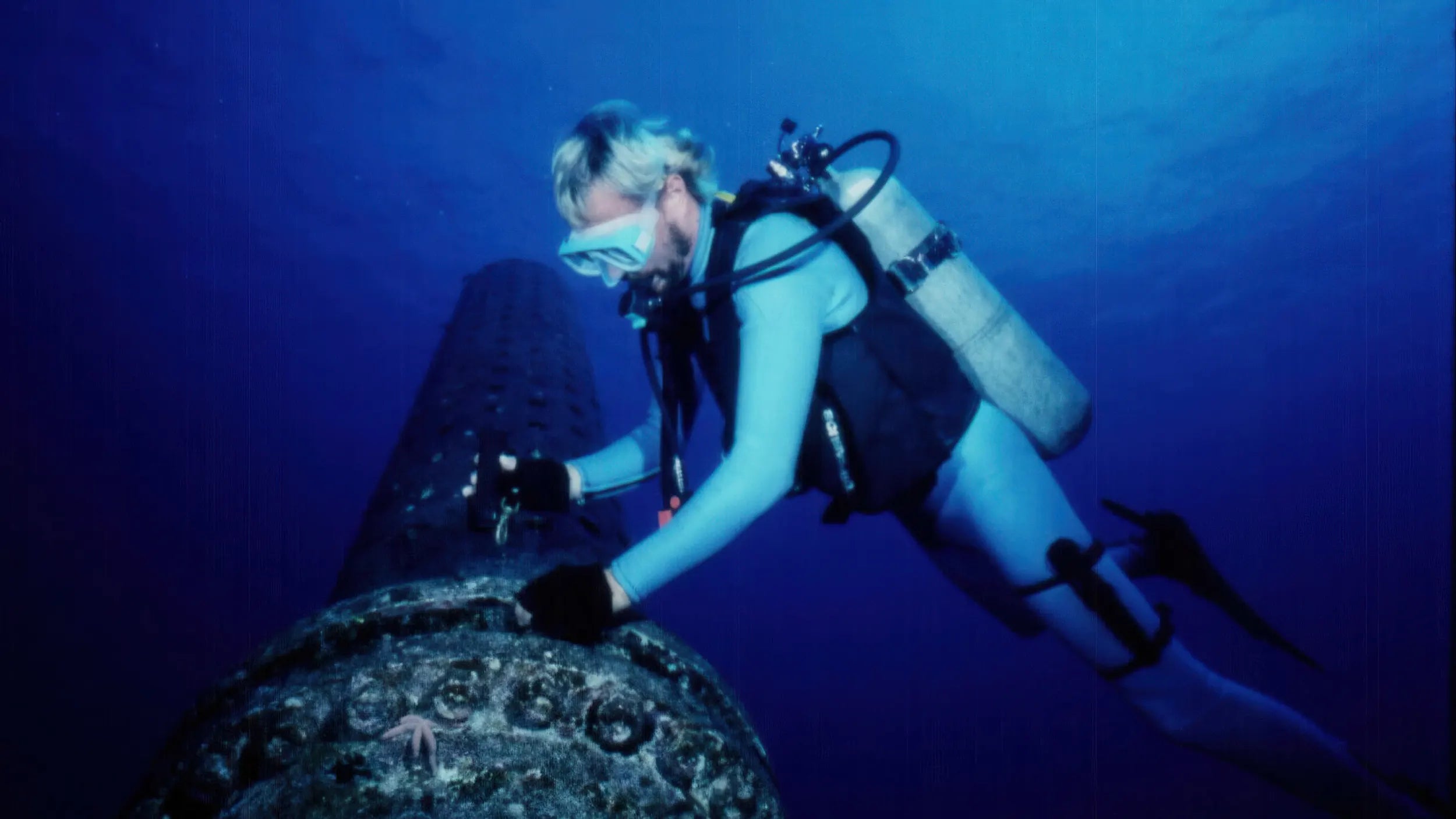 Diver fixing the deep sea pipes at HOST Park underwater