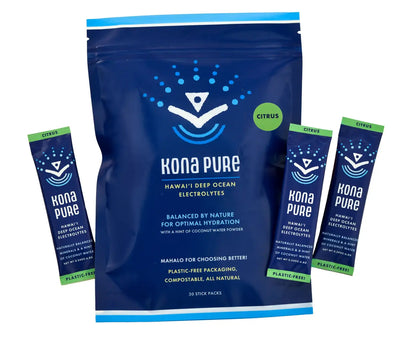 Kona Pure electrolyte powder package with multiple stick packs on a white background