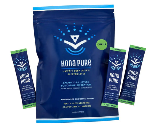 Kona Pure electrolyte powder package with multiple stick packs on a white background